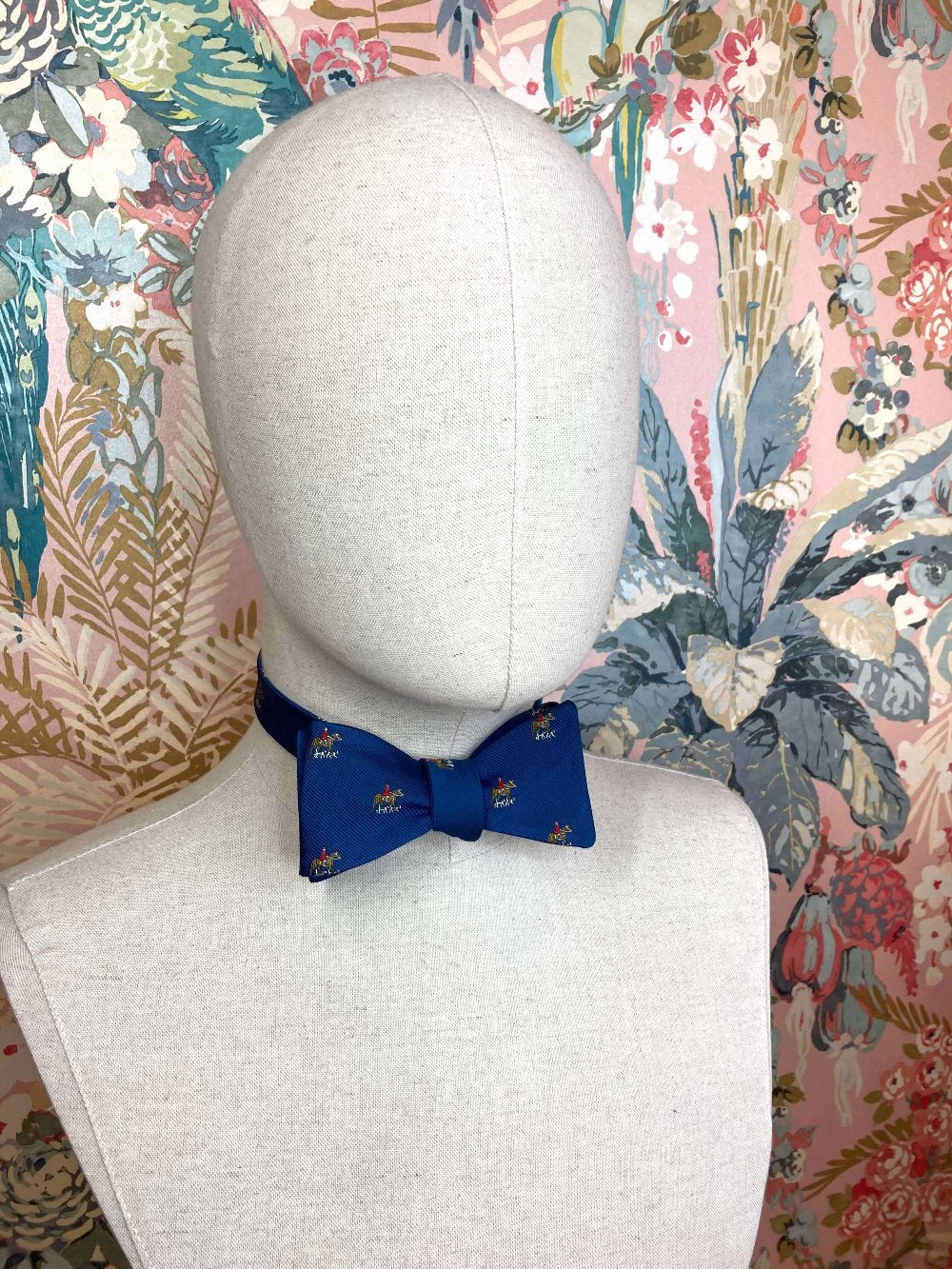 blue jacquard silk self tie bow tie with a horse and hounds motif